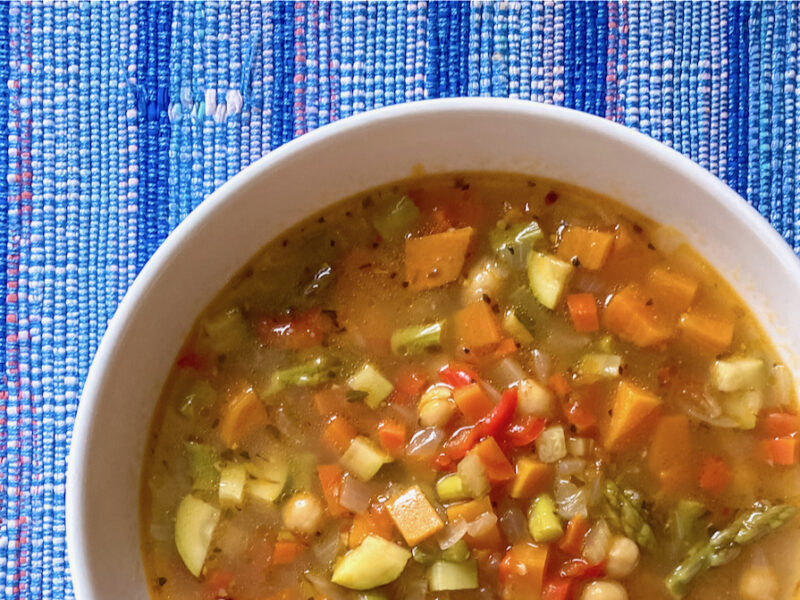 Winter Vegetable & Chickpea Soup on handmade blue placemat