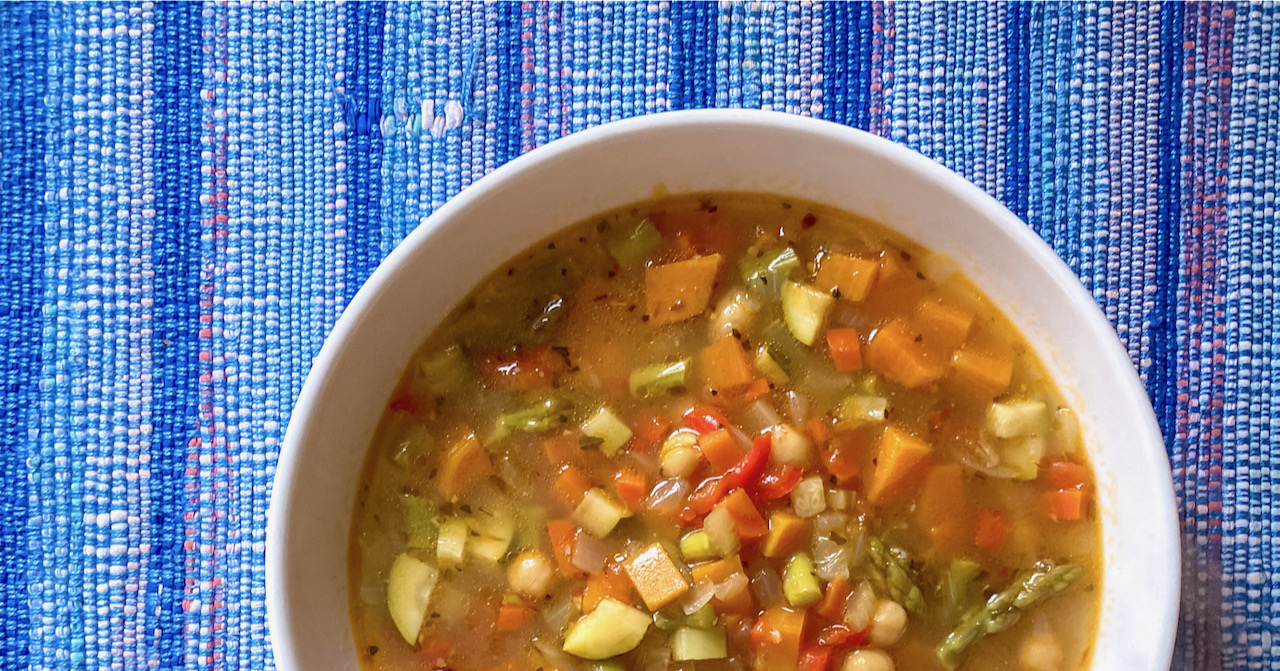 Winter Vegetable & Chickpea Soup on handmade blue placemat